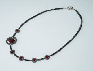 Becky Congdon "Off Centered Ribbon Necklace" handmade flameworked glass beads, hematite gemstone, SS 22" $150.