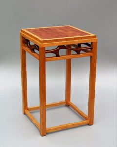 Tracy Fiegl "Katharine" Handmade table made of makore veneer, cherry and walnut woods 16"Wx16"Dx26"H $1,400.