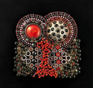 San Fortune "Barbute" 3.5x3.5 bead embroidery on framed black panel raku focal, red pottery focal, black Swarovski bicone crystals, red glass flowers, glass seed beads, glass tila beads, glass grey teardrops $280.
