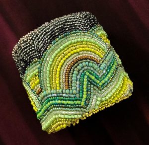 San Fortune "2.75" Green Waves Cuff" (view A) various size seed beads with natural stone closure $240.