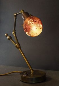 Ross Delano "Luna de sangre" 11" tall 13" wide 5" depth aged brass and sculpted glass lamp $890. (shown lighted)