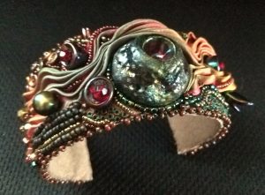 Ann Recotta "Eruption" (View A) 1.5" wide cuff with bead embroidery and bead weaving $200.