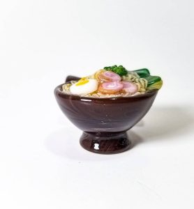This is an example from the new series we have at the Gallery: "Tonkotsu Ramen Pendant" and "Shrimp Ramen Pendant" flameworked glass pendants by Aaron Rovner-Buck. Inquire for images, sizing and pricing.